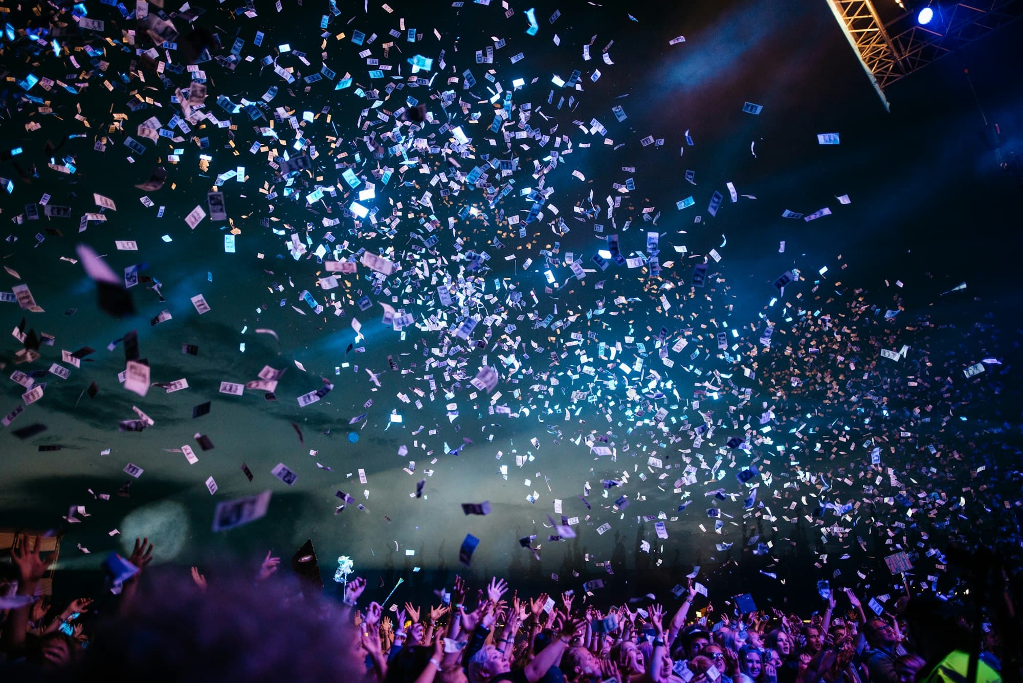 Live event with stage lights and confetti